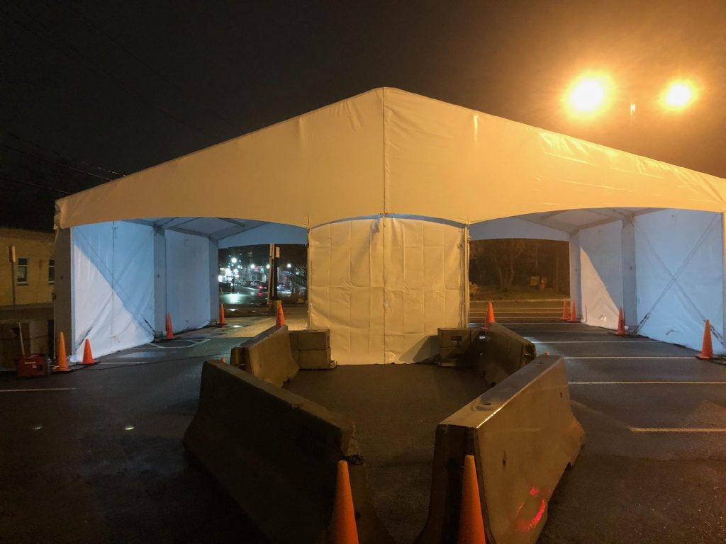 Base camp tent structures deployed in field conditions for military disaster relief operations