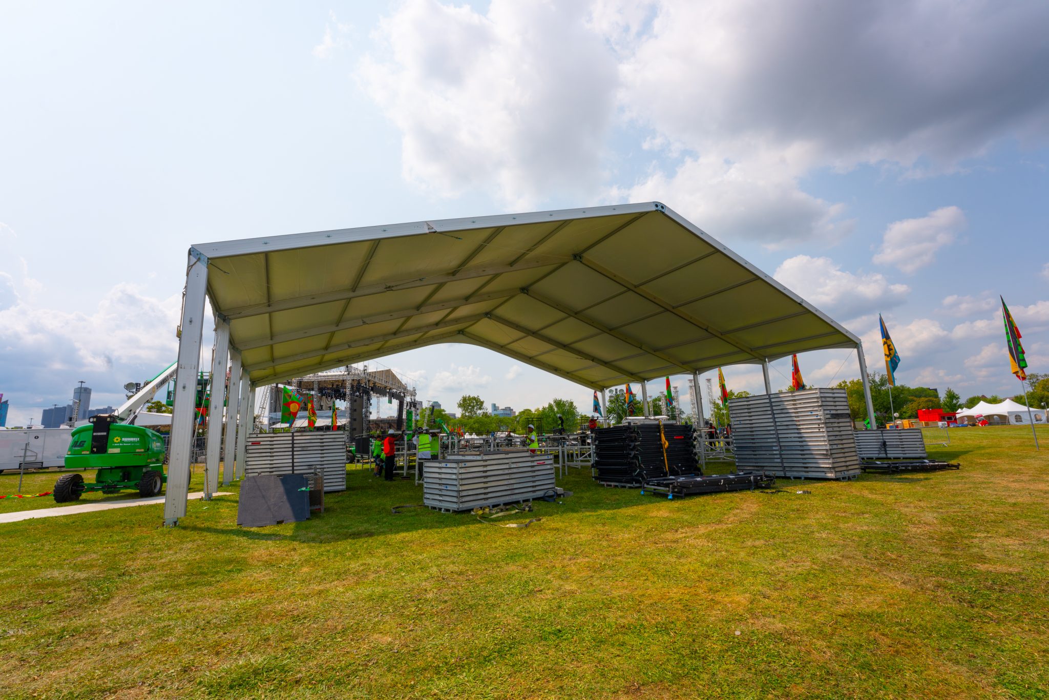 Clearspan structure tent covering a festival stage setup with lighting rigs and equipment