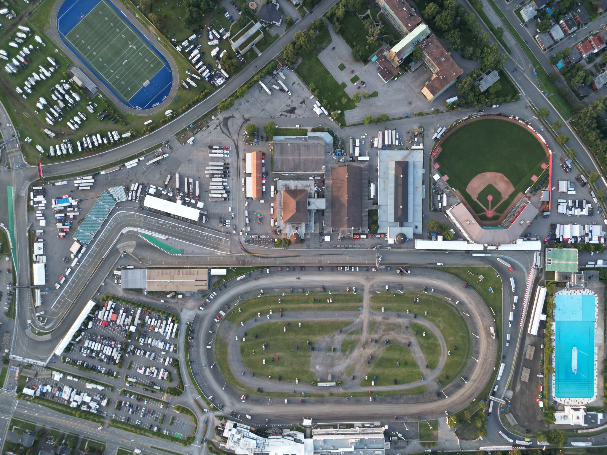 Aerial View — Grand Stand Structures at Detroit Grand Prix Aerial view of racing venue showing multiple grand stand structure tents with covered spectator seating and pit lane access