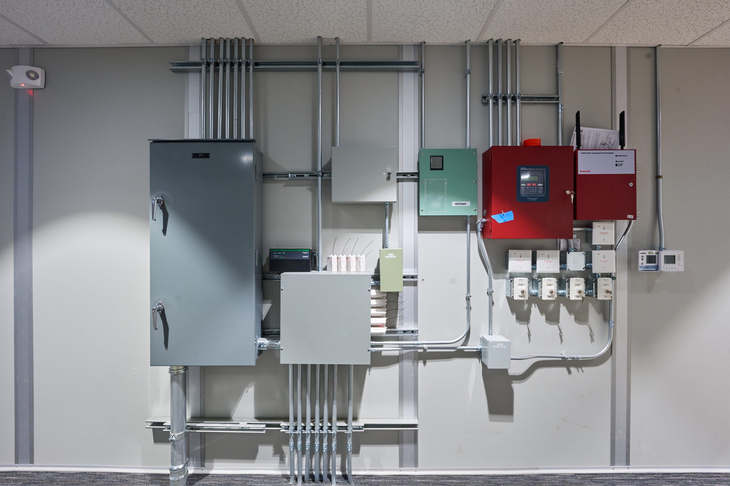 Commercial electrical panels, fire alarm system, and power distribution in code-compliant temporary office building